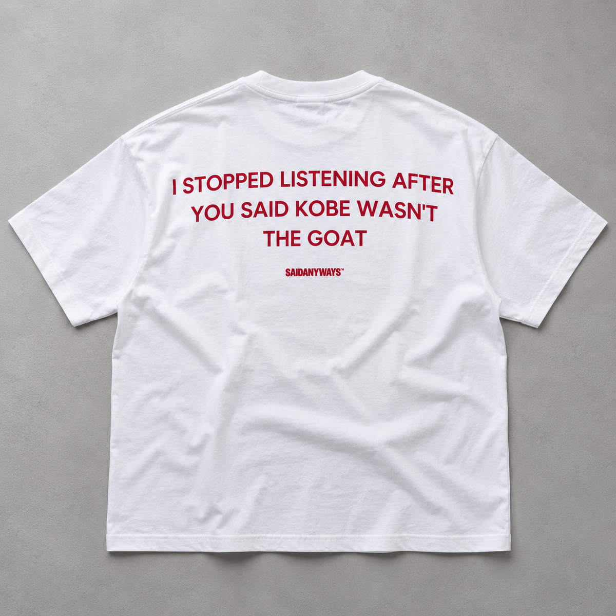 I Stopped Listening After You Said Kobe Wasn't The GOAT white tee, flat lay