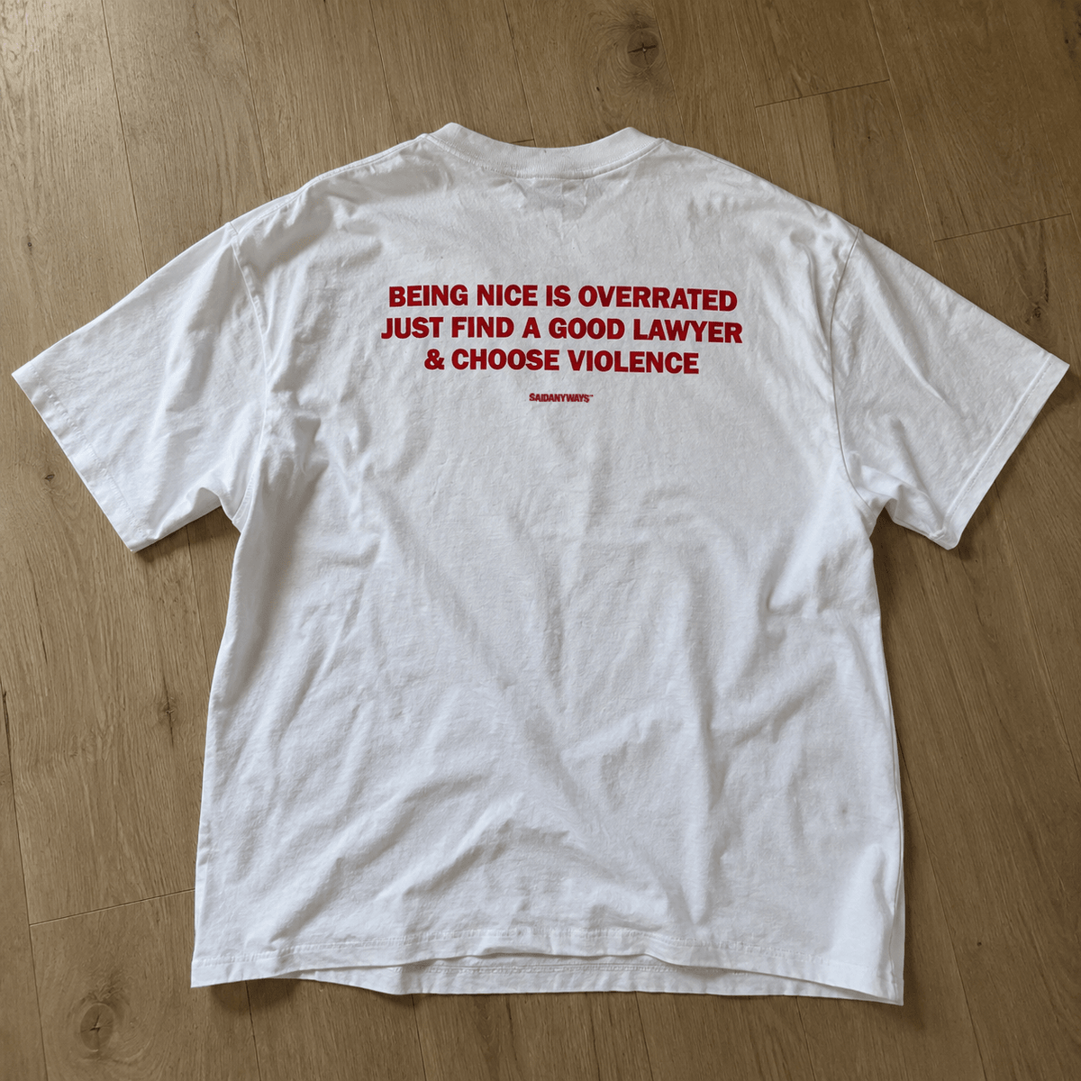 Being Nice Is Overrated Just Find A Good Lawyer & Choose Violence — White Tee - SAIDANYWAYSBeing Nice Is Overrated Just Find A Good Lawyer & Choose Violence — White TeeT-ShirtSAIDANYWAYS