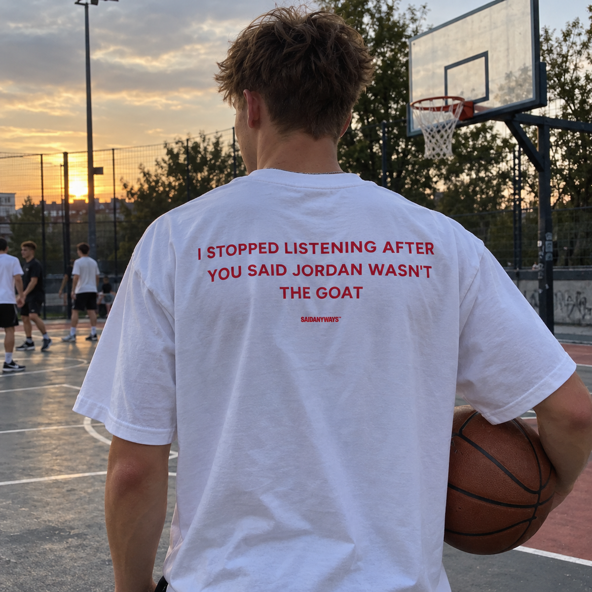 I Stopped Listening After You Said Jordan Wasn't The GOAT white tee, worn on a basketball court