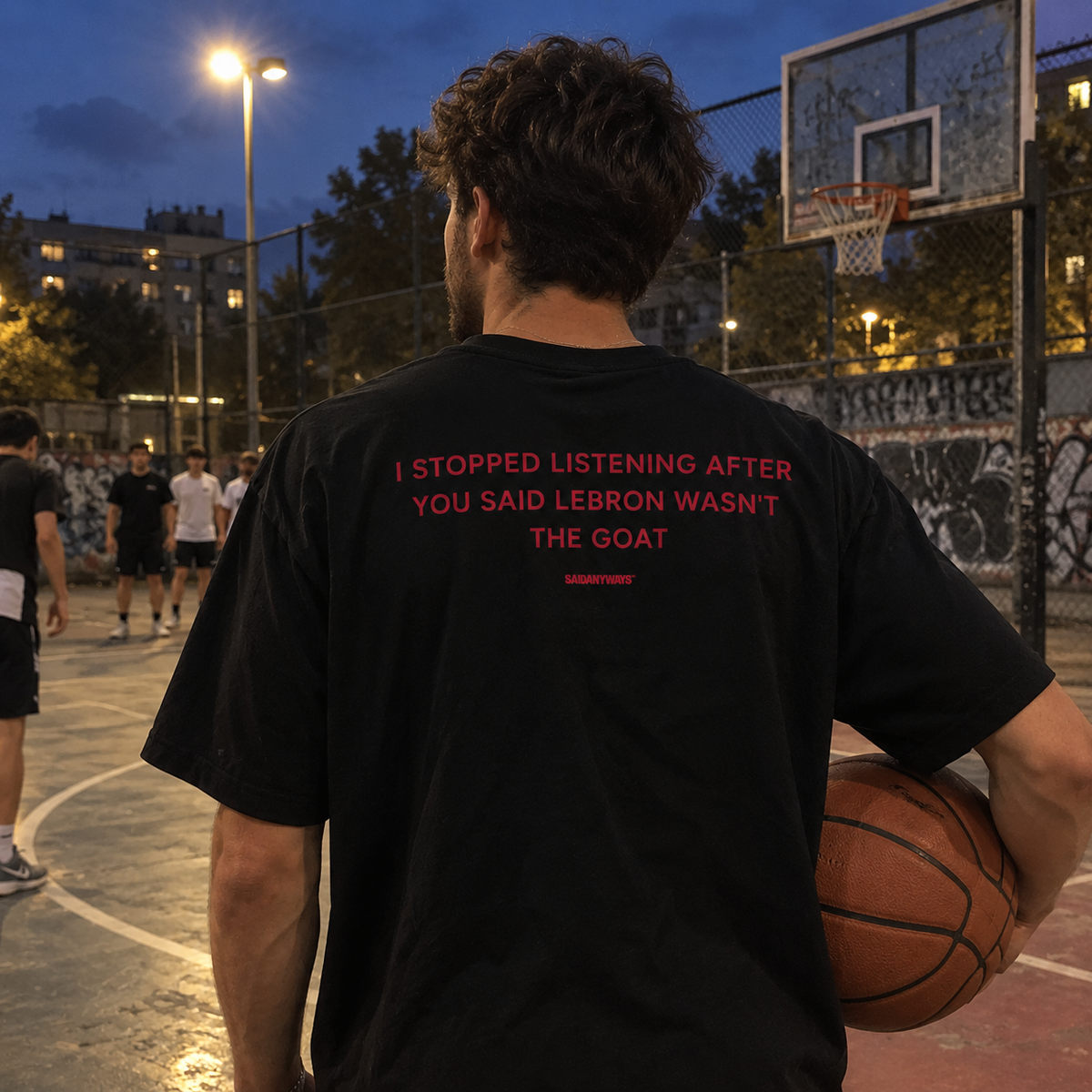 I Stopped Listening After You Said LeBron Wasn't The GOAT black tee, worn on a basketball court