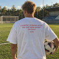 I Stopped Listening After You Said Messi Wasn't The GOAT white tee, worn on a football pitch