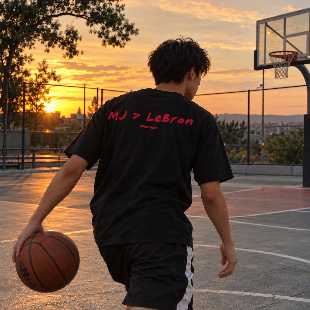 MJ > LeBron Basketball Debate black tee, worn on a basketball court