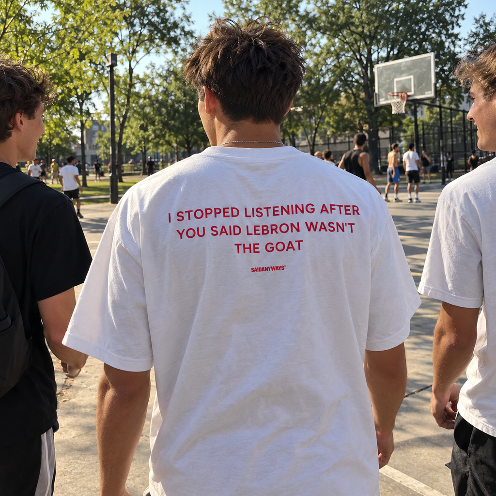 I Stopped Listening After You Said LeBron Wasn't The GOAT white tee, worn walking with friends to a basketball court