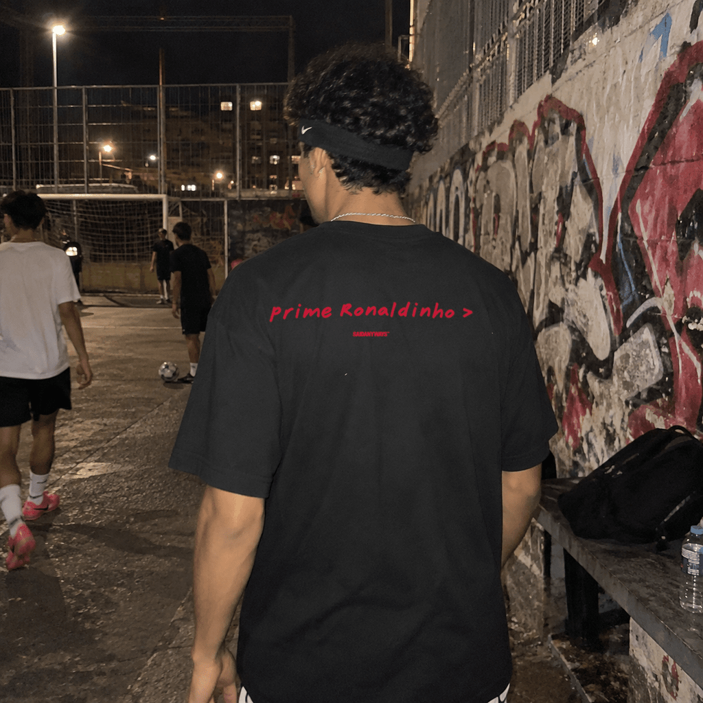 Prime Ronaldinho > Football Debate — Black Tee - SAIDANYWAYSPrime Ronaldinho > Football Debate — Black TeeT-ShirtSAIDANYWAYS